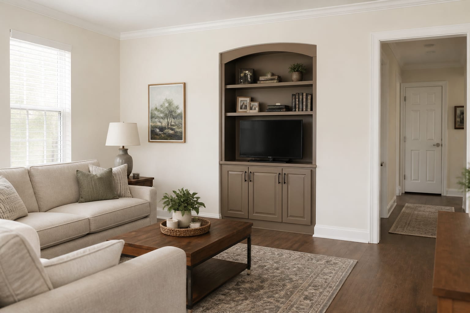 Illustrative residential living room with freshly painted neutral walls, cabinetry, and crisp white trim; not a completed Brown’s Touch project.